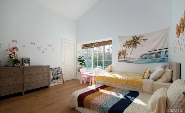 a bed room with a bed and a window