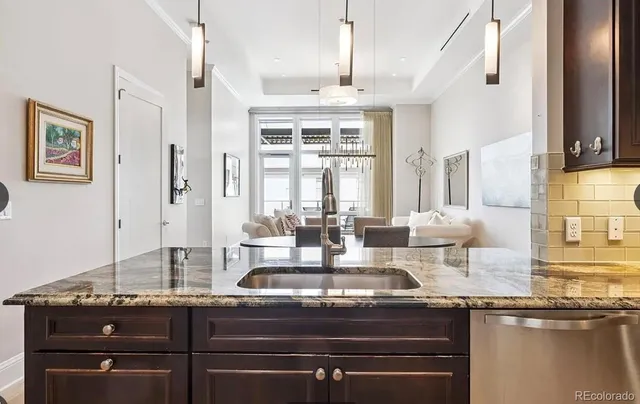 a kitchen with a stove and a sink