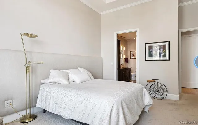 a bedroom with a bed and a table