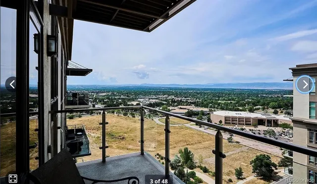 a view of swimming pool from a balcony