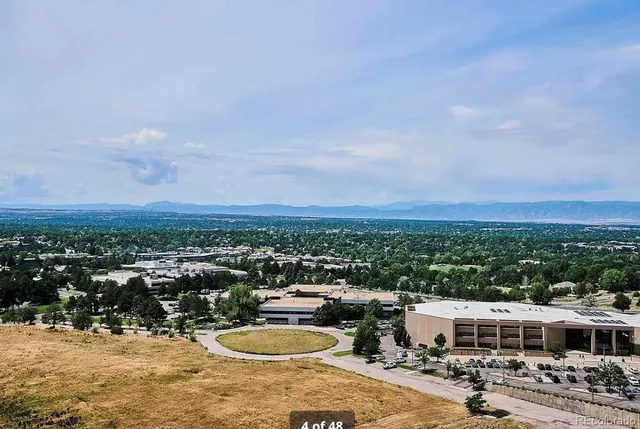 a view of a city and mountains in the background