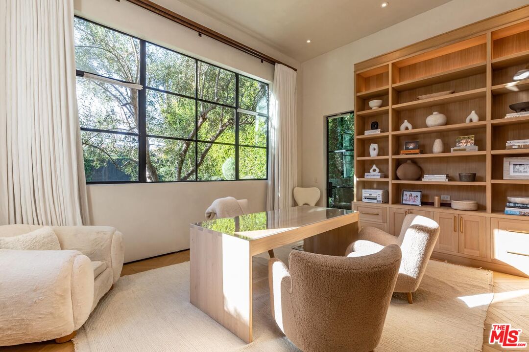 250 South Rockingham Avenue Los Angeles, CA 90049 - Photo 13 of 20 a living room with furniture and a large window