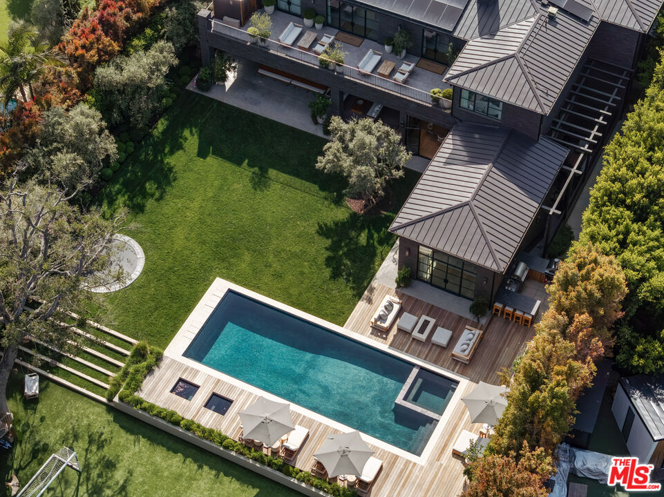 250 South Rockingham Avenue Los Angeles, CA 90049 - Photo 17 of 20 an aerial view of a house with garden space and deck