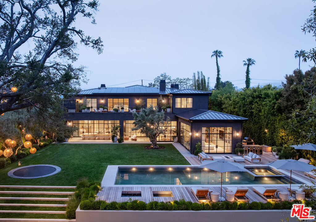 250 South Rockingham Avenue Los Angeles, CA 90049 - Photo 19 of 20 a front view of a house with garden