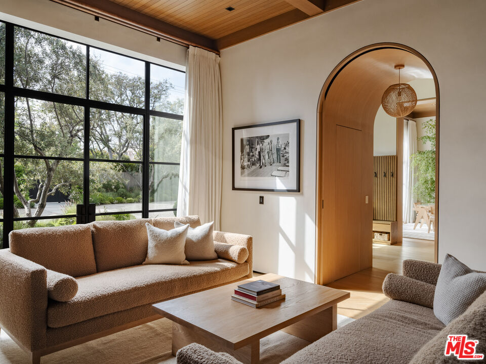 250 South Rockingham Avenue Los Angeles, CA 90049 - Photo 2 of 20 a living room with furniture and a large window