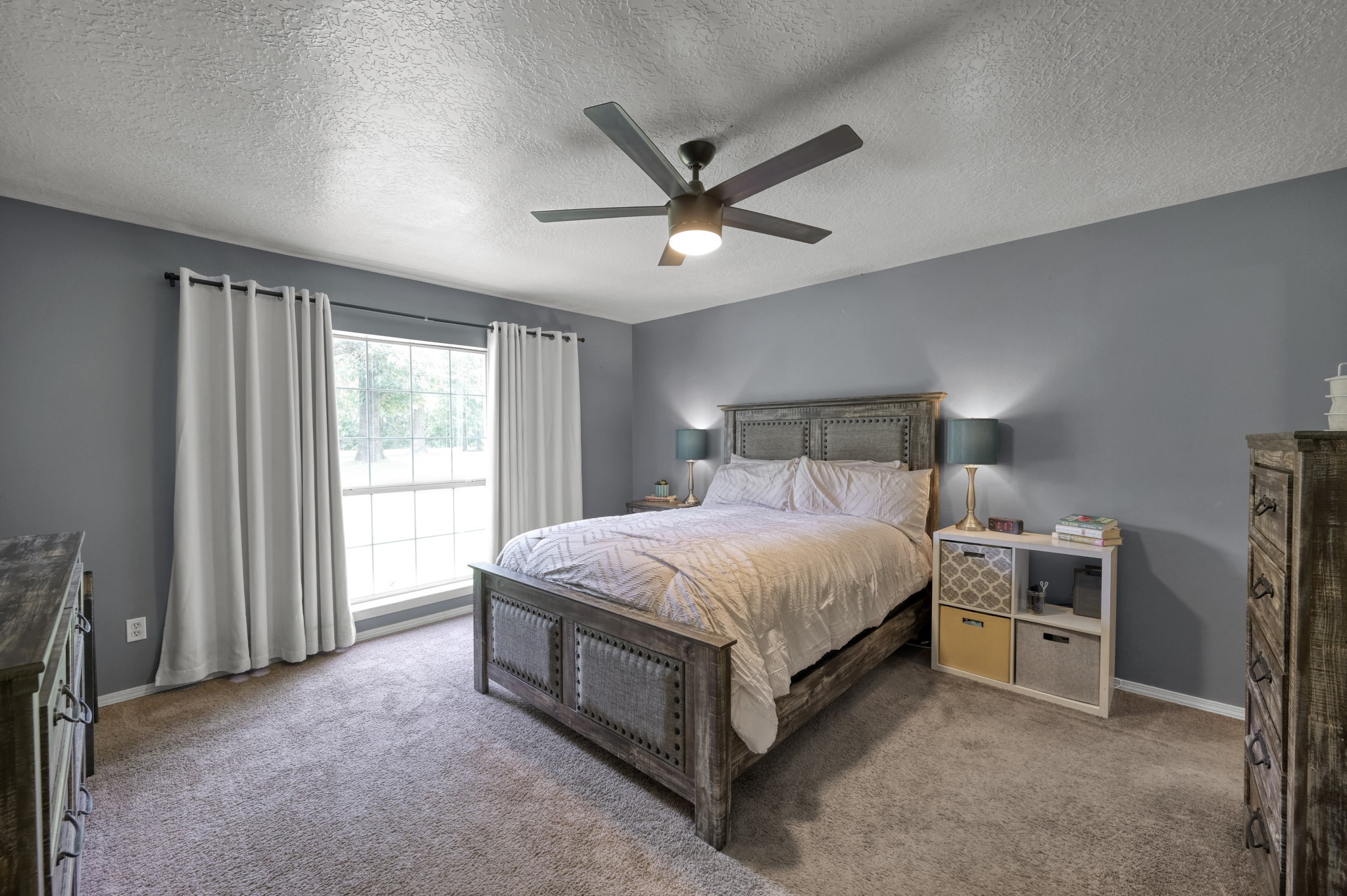 14909 Pine Tree Road Montgomery, TX 77356 - Photo 16 of 49 Entering the spacious primary bedroom with large window offering fantastic natural light