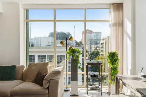 a living room filled with furniture and a window