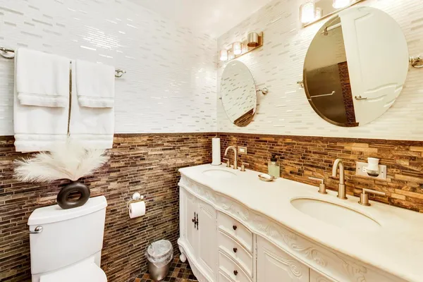 a bathroom with a sink mirror vanity and toilet