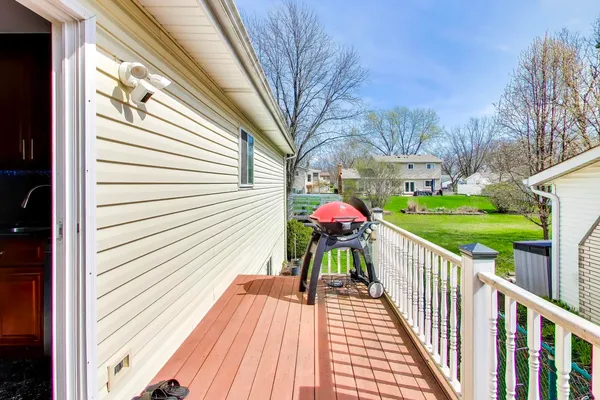 a view of a house with a yard porch and sitting area