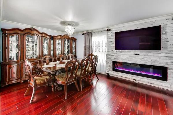a living room with furniture fireplace and flat screen tv
