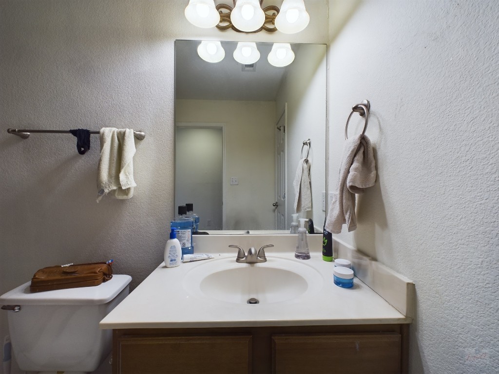 500 East 48th Street, Unit B Austin, TX 78751 - Photo 13 of 32 a bathroom with a sink and a mirror
