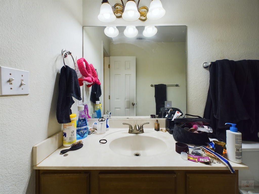 500 East 48th Street, Unit B Austin, TX 78751 - Photo 22 of 32 a bathroom with a sink and a mirror