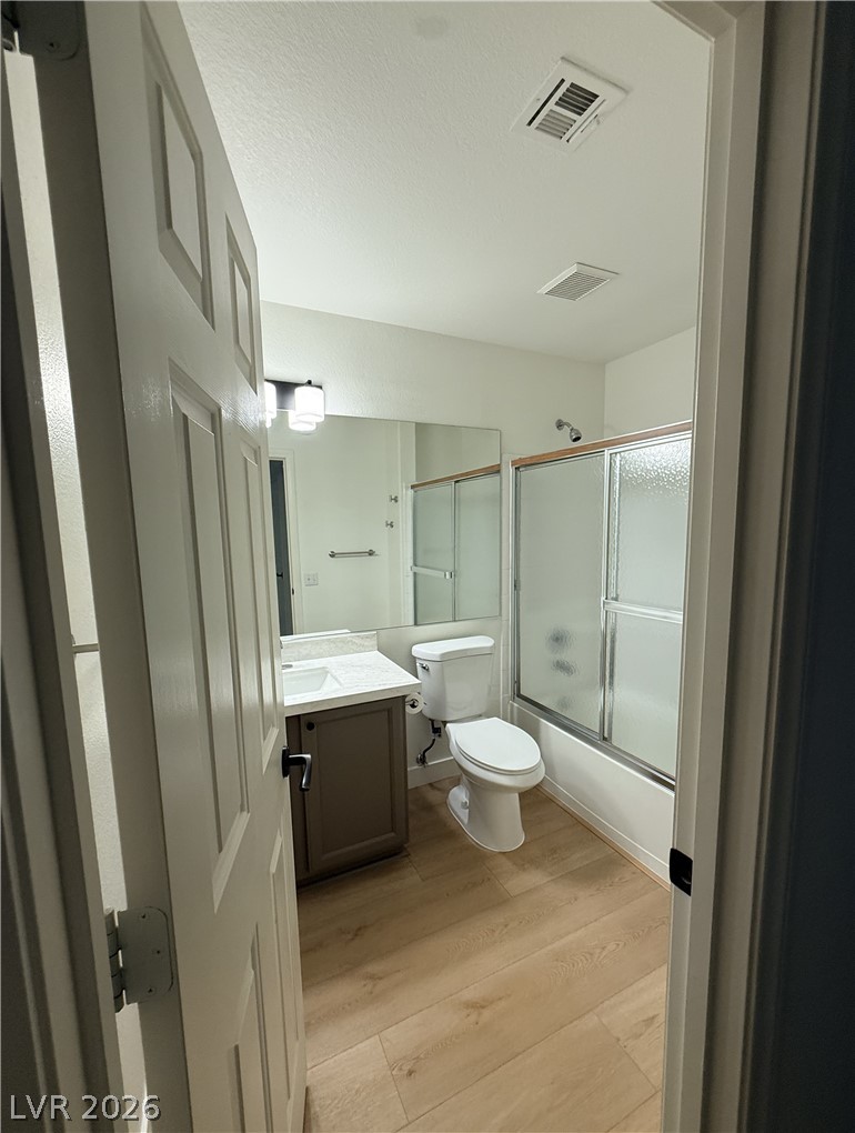 2122 Hidden Ranch Terrace Henderson, NV 89052 - Photo 14 of 20 A well-appointed bath features a sleek vanity, convenient toilet, and a glass-enclosed shower.
