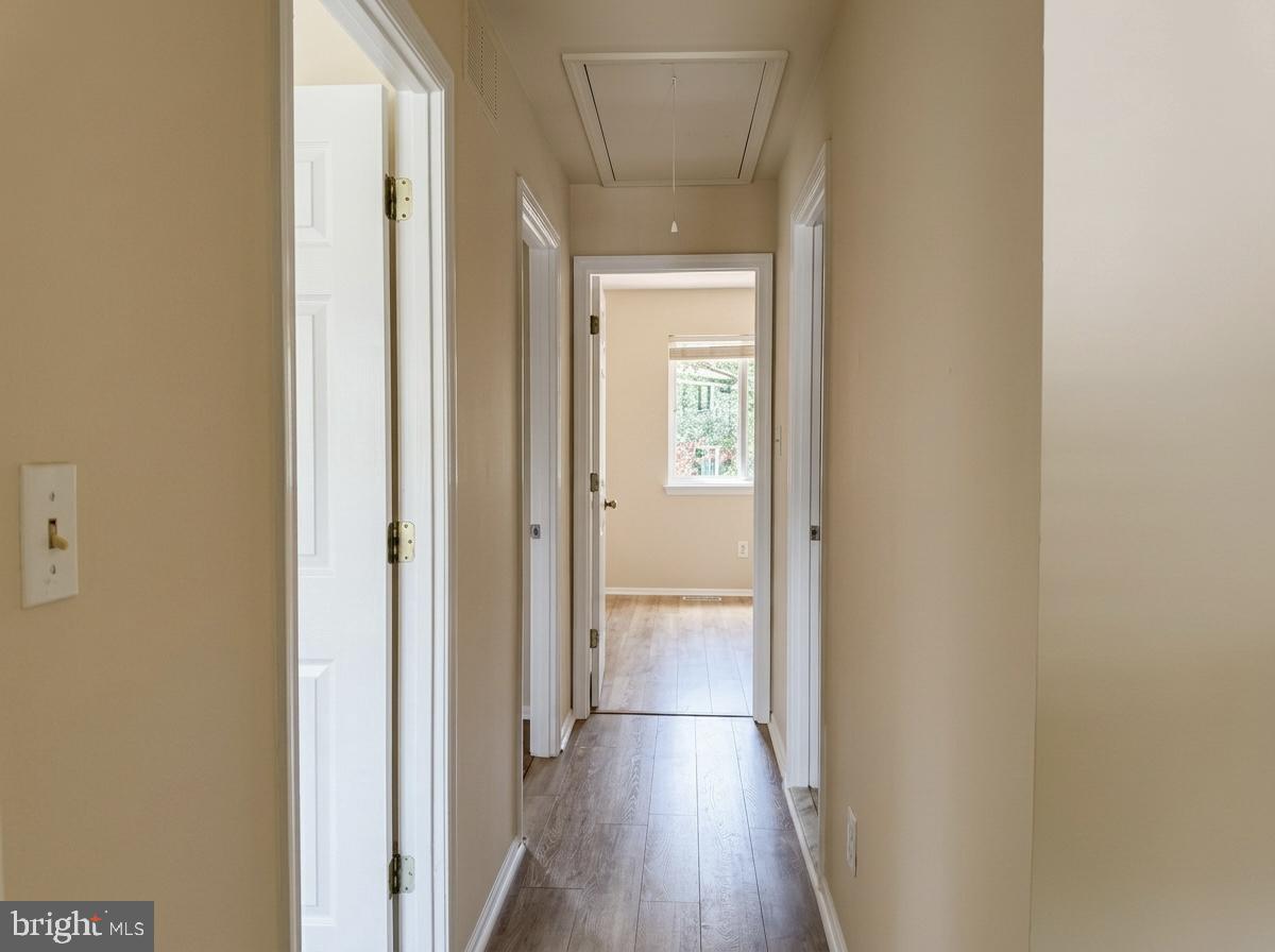 3614 Fawn Spring Court Baltimore, MD 21234 - Photo 13 of 22 a view of a hallway with wooden floor
