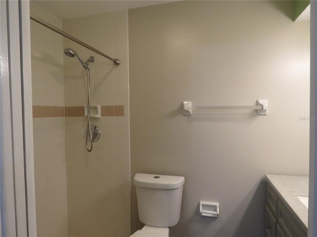 418 Narvaezi Street Venice, FL 34285 - Photo 17 of 67 a bathroom with a toilet sink and shower