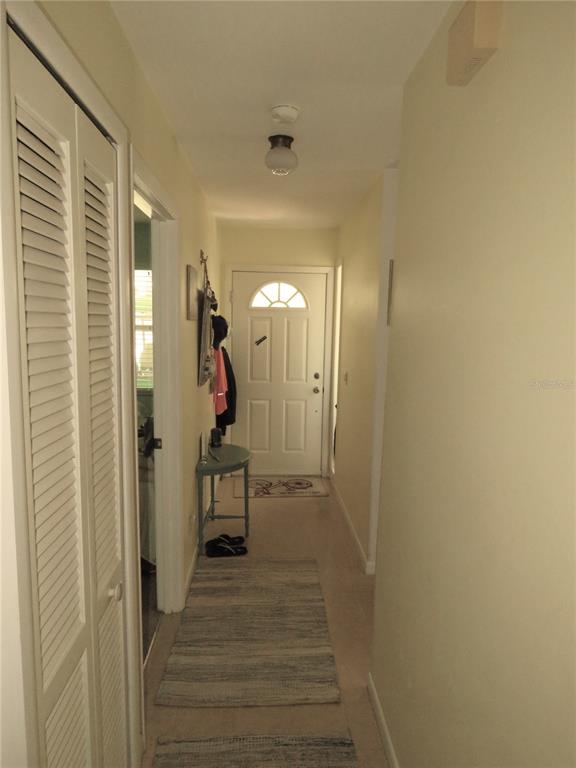 418 Narvaezi Street Venice, FL 34285 - Photo 23 of 67 a view of a hallway with wooden floor and staircase