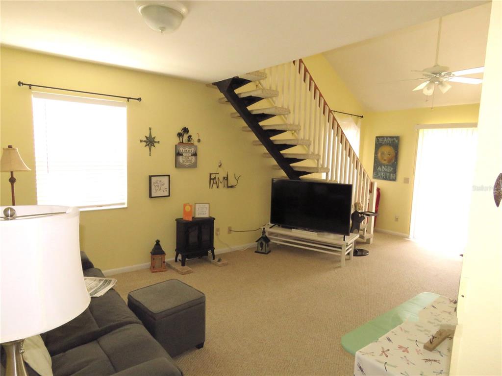 418 Narvaezi Street Venice, FL 34285 - Photo 27 of 67 a living room with furniture and a flat screen tv