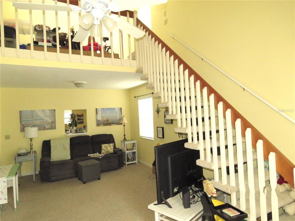418 Narvaezi Street Venice, FL 34285 - Photo 28 of 67 a view of a balcony with furniture and staircase