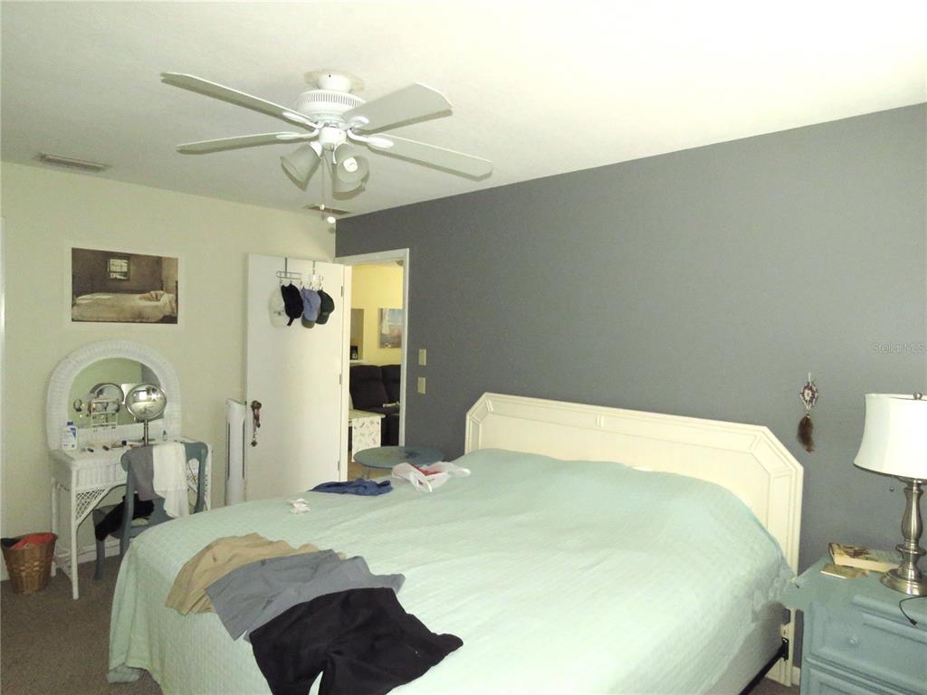 418 Narvaezi Street Venice, FL 34285 - Photo 31 of 67 a bedroom with a bed and ceiling fan