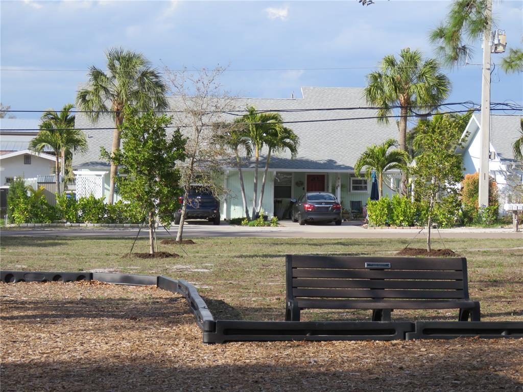 418 Narvaezi Street Venice, FL 34285 - Photo 40 of 67 a view of a house with a yard and a fountain