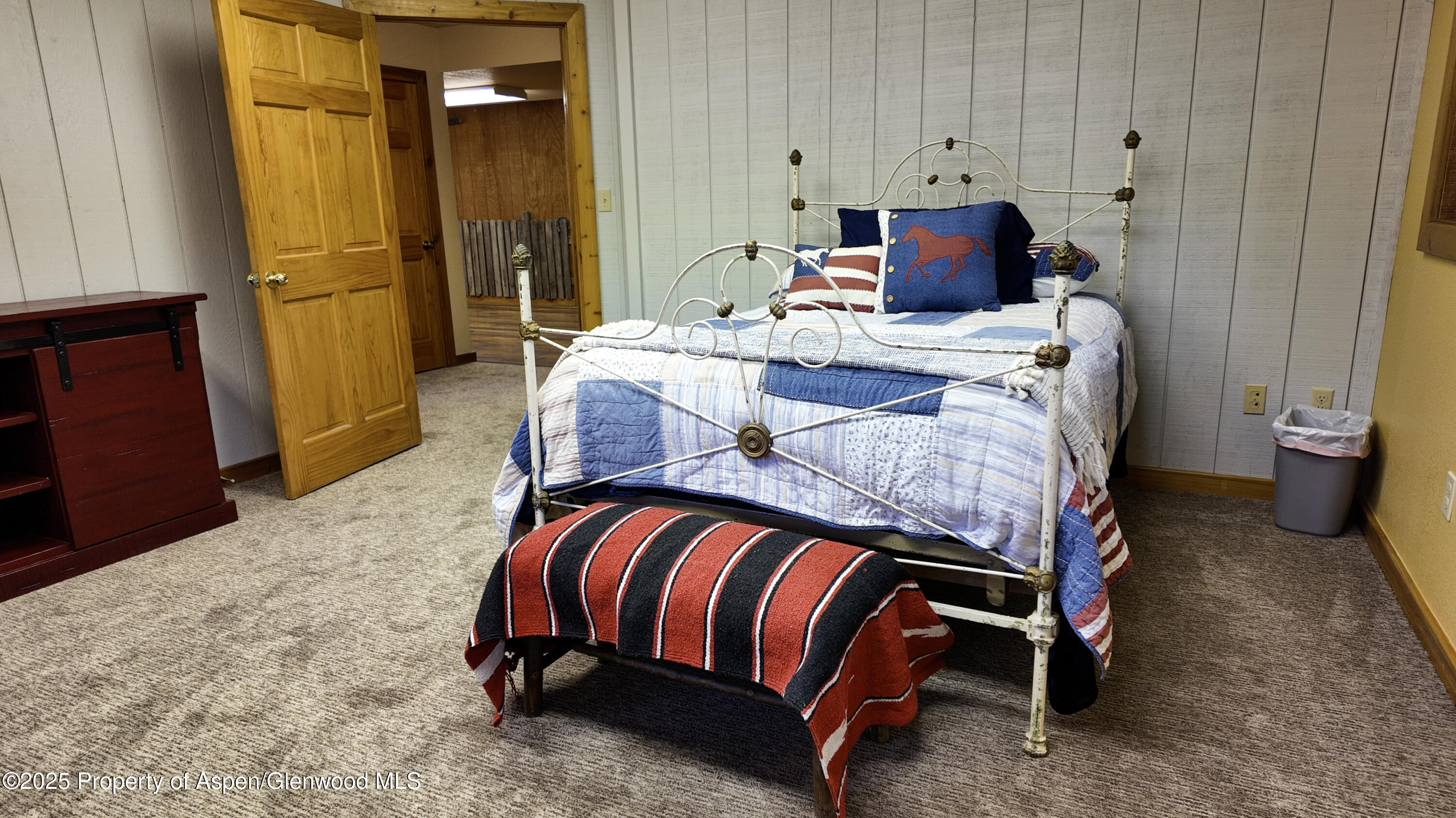 8700 County Road 300 Parachute, CO 81635 - Photo 165 of 201 a bedroom with a bed and teddy bear on bed