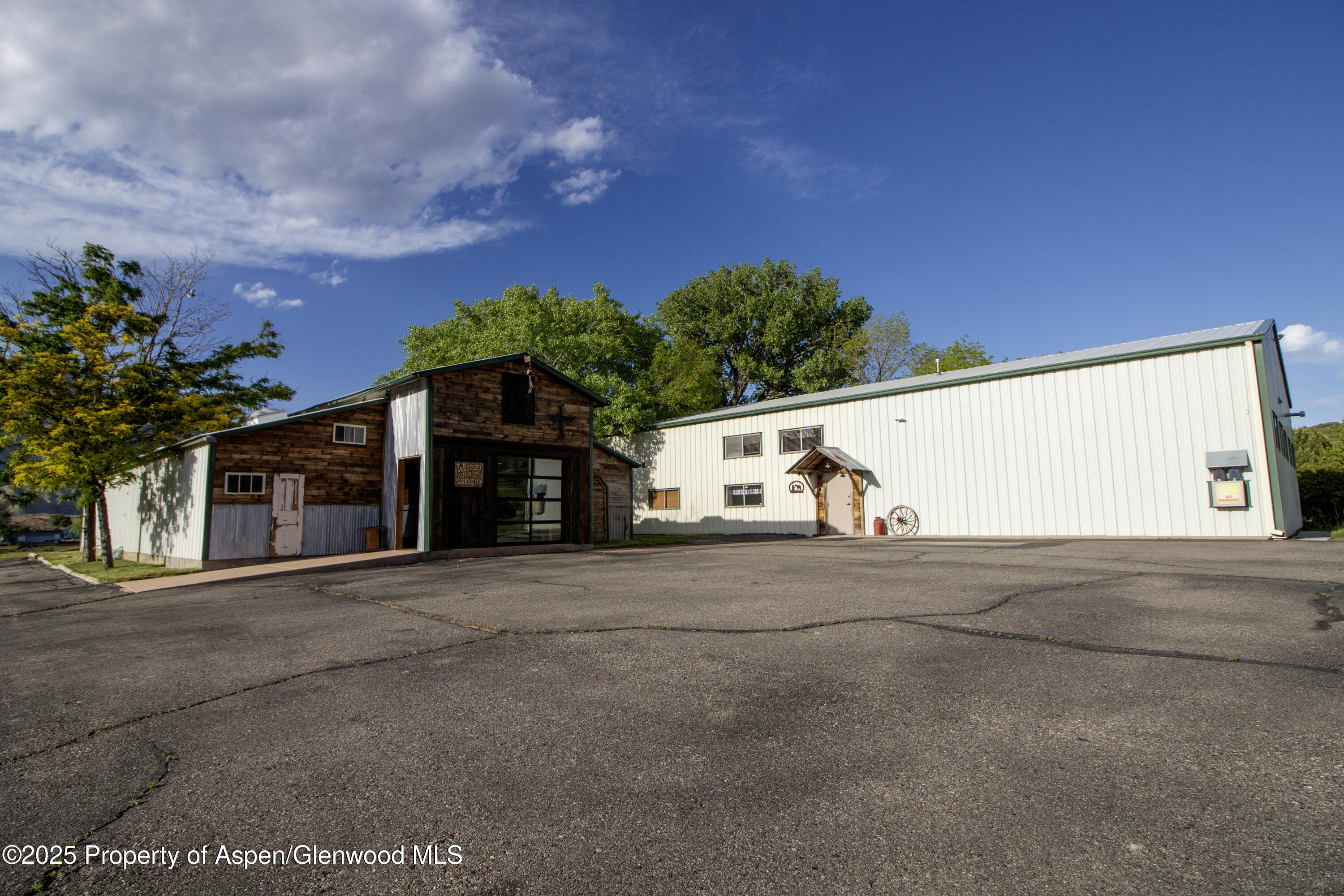 8700 County Road 300 Parachute, CO 81635 - Photo 182 of 201 a front view of a house with a yard and garage