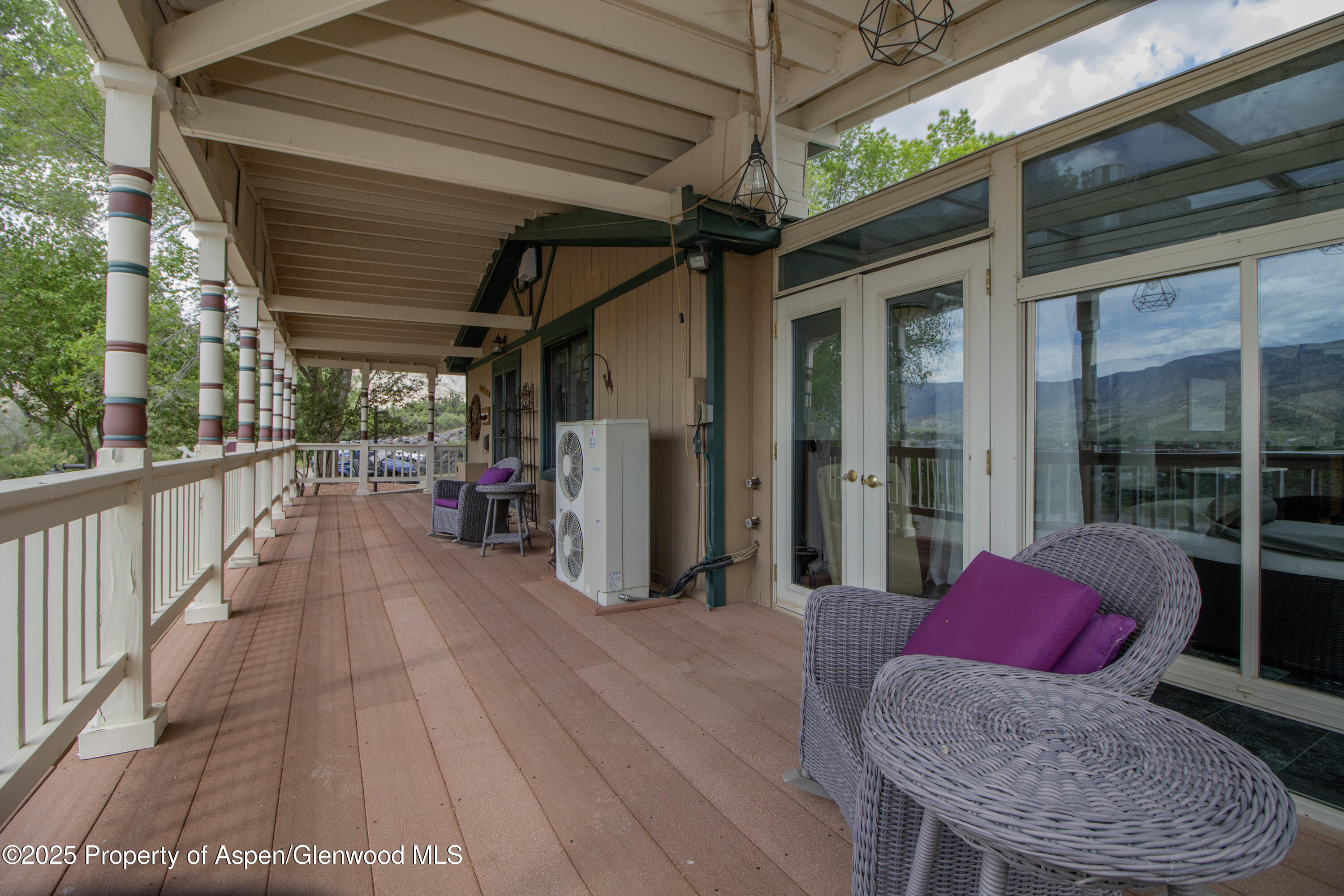 8700 County Road 300 Parachute, CO 81635 - Photo 29 of 201 a view of a porch with furniture and wooden floor