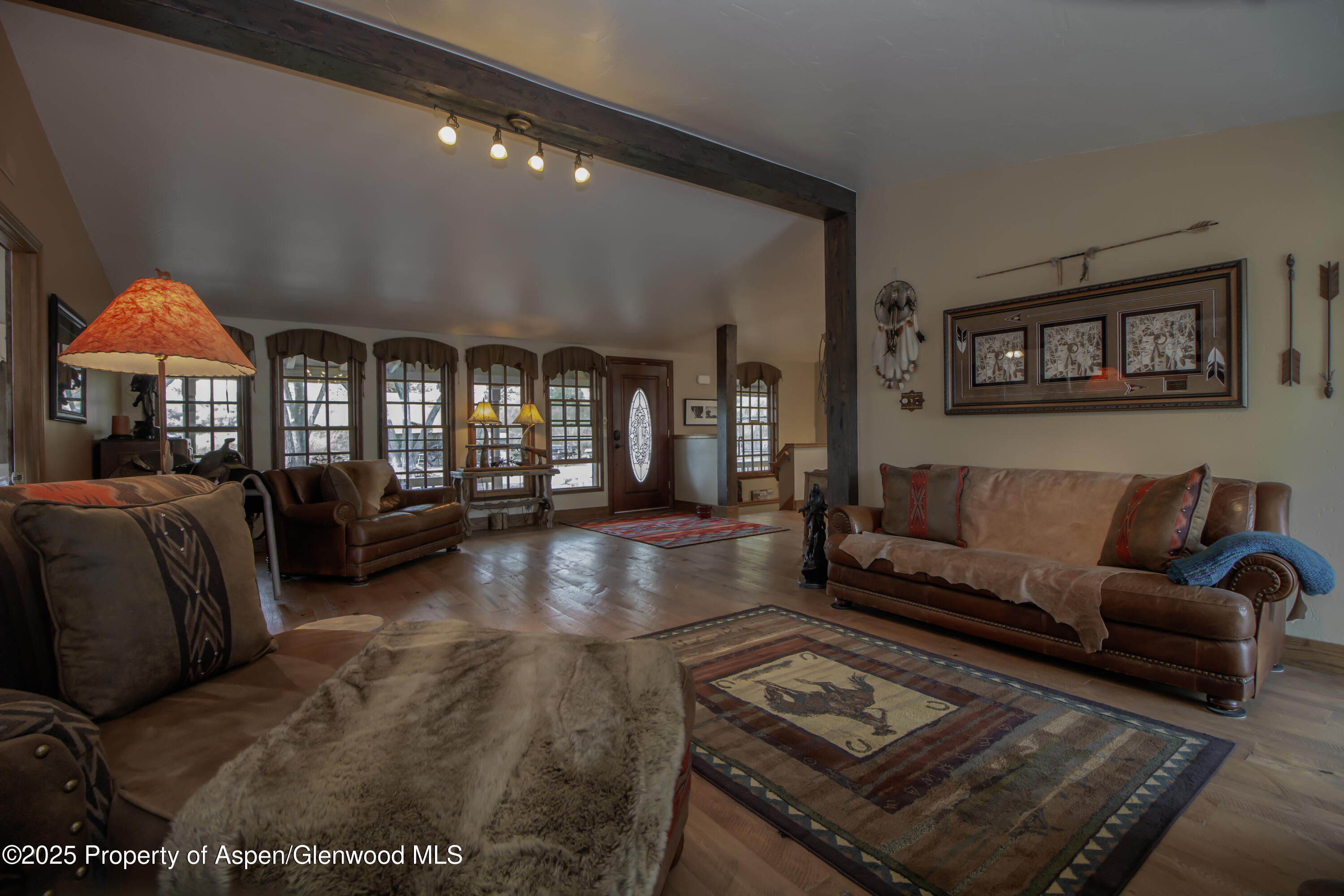 8700 County Road 300 Parachute, CO 81635 - Photo 34 of 201 a living room with furniture and a lamp