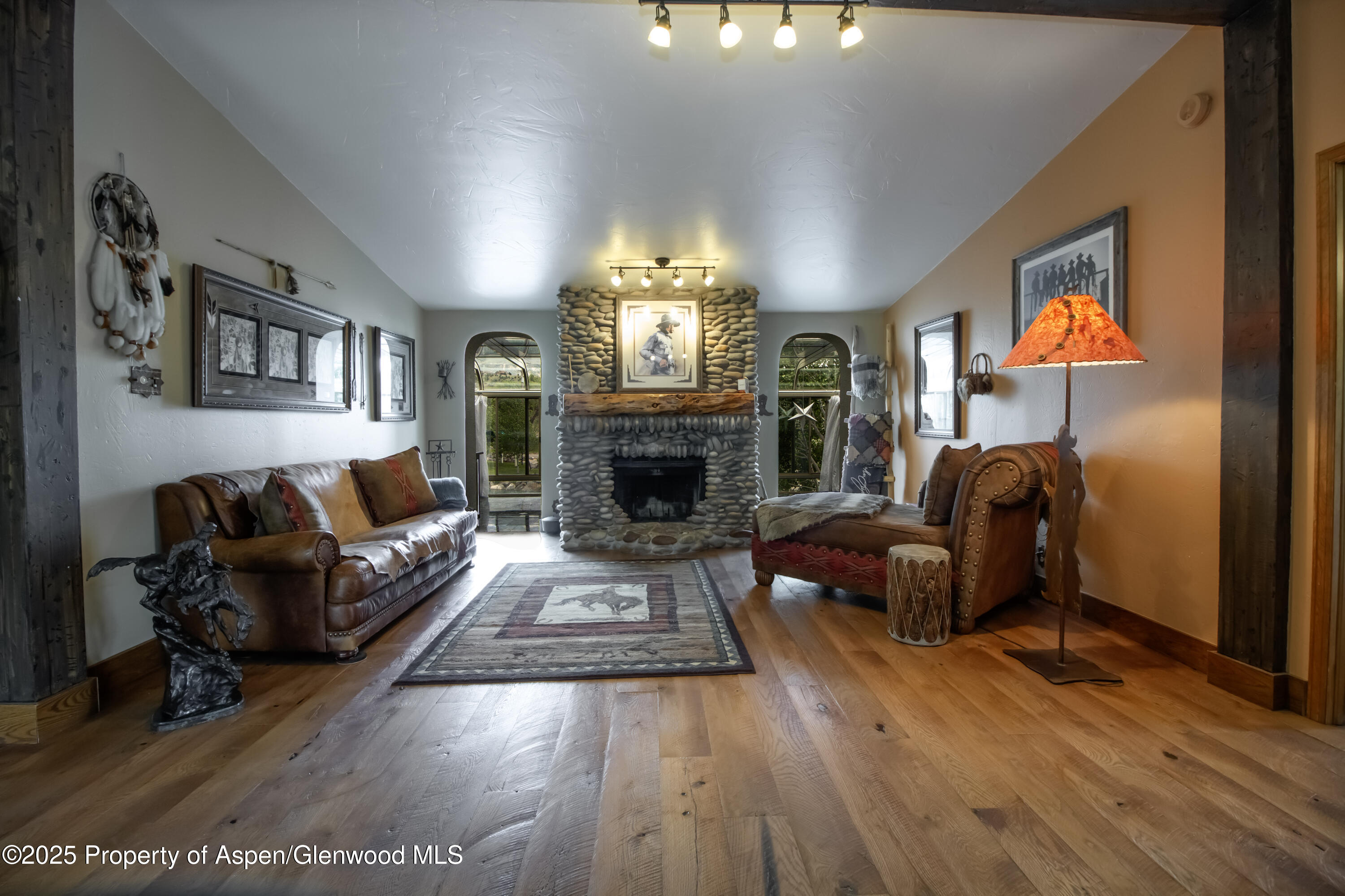 8700 County Road 300 Parachute, CO 81635 - Photo 36 of 201 a living room with furniture and a fireplace