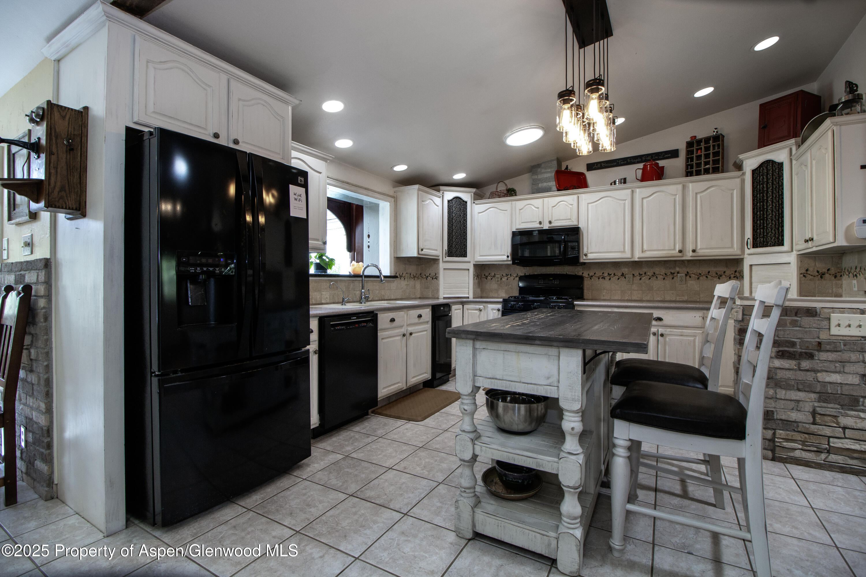 8700 County Road 300 Parachute, CO 81635 - Photo 44 of 201 a kitchen with stainless steel appliances granite countertop a refrigerator and a stove top oven