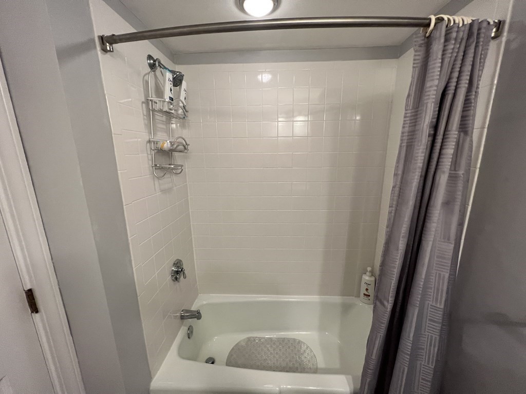 12 State Road, Unit 2E Plymouth, MA 02360 - Photo 13 of 28 a bathroom with a shower and a bath tub