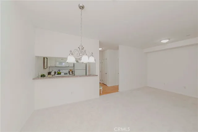 a spacious bathroom with a granite countertop sink a toilet and shower