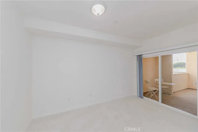 a bedroom with a bed and a ceiling fan