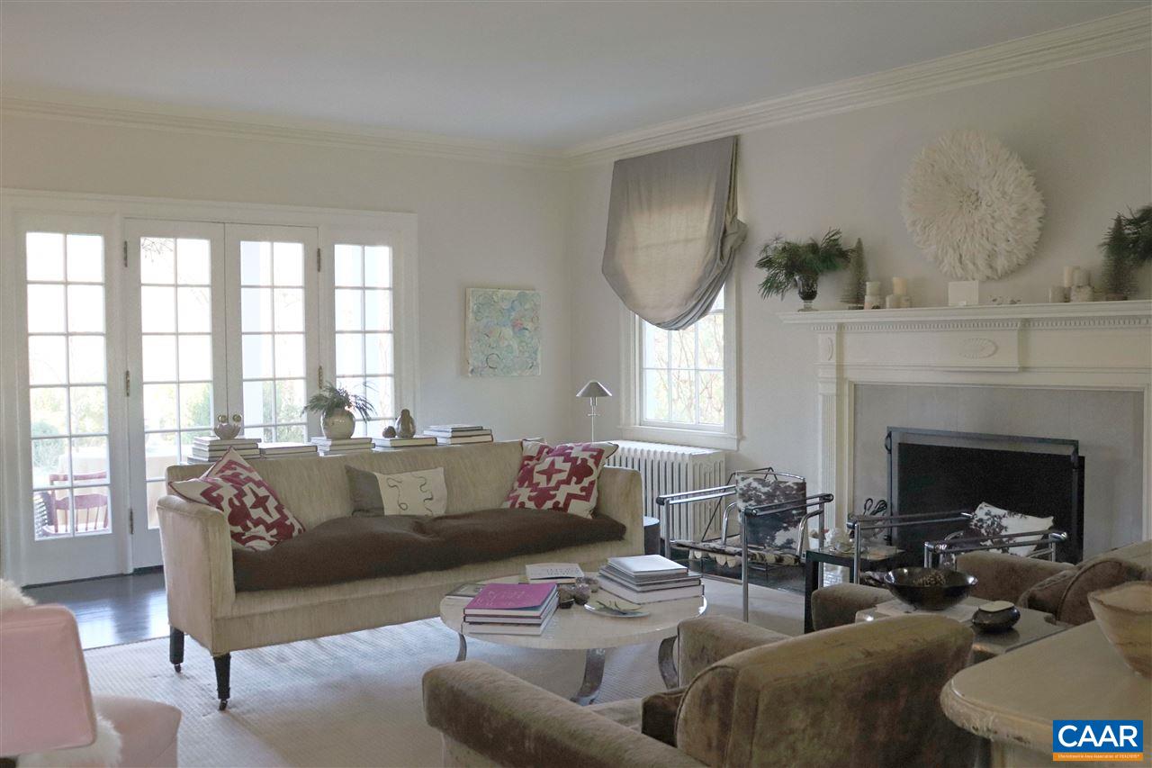 1101 Rugby Road Charlottesville, VA 22903 - Photo 13 of 43 a living room with furniture and a fireplace