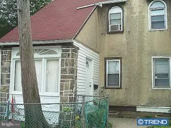 246 Heather Road Upper Darby, PA 19082 - Photo 1 of 7 a front view of a house with a glass windows