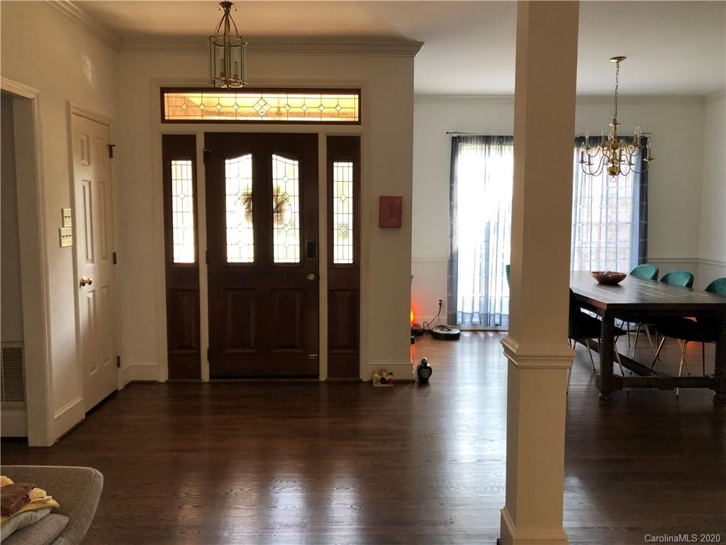 426 St Michaels Way, Unit 15 Fort Mill, SC 29708 - Photo 3 of 25 a view of a hallway with wooden floor and windows