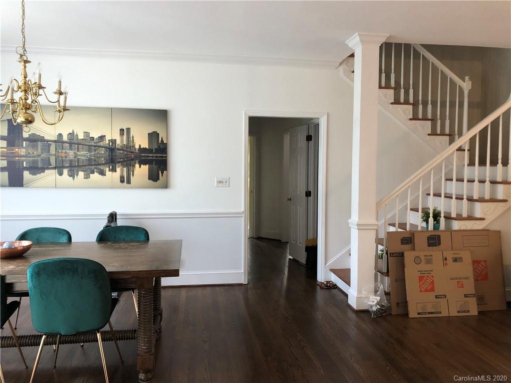 426 St Michaels Way, Unit 15 Fort Mill, SC 29708 - Photo 6 of 25 a view of a dining room with furniture and wooden floor