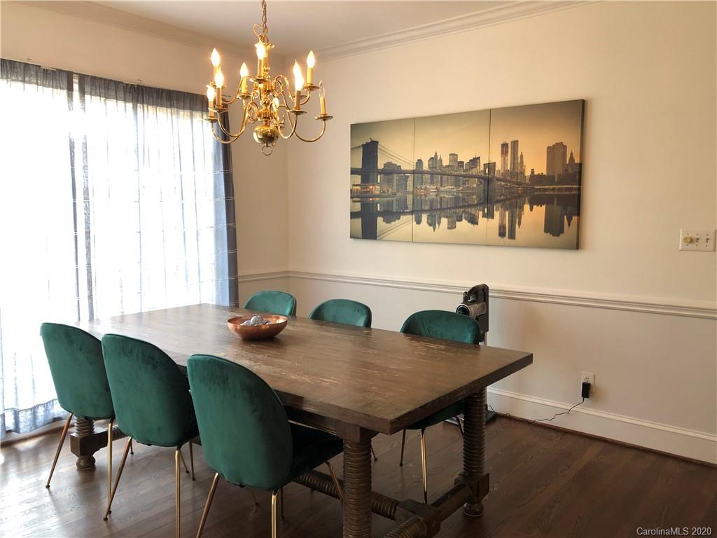 426 St Michaels Way, Unit 15 Fort Mill, SC 29708 - Photo 7 of 25 a view of a dining room with furniture and chandelier