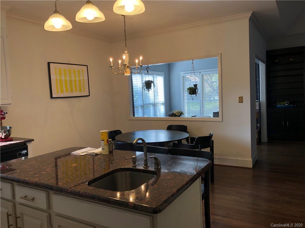 426 St Michaels Way, Unit 15 Fort Mill, SC 29708 - Photo 9 of 25 a kitchen with a sink and chandelier