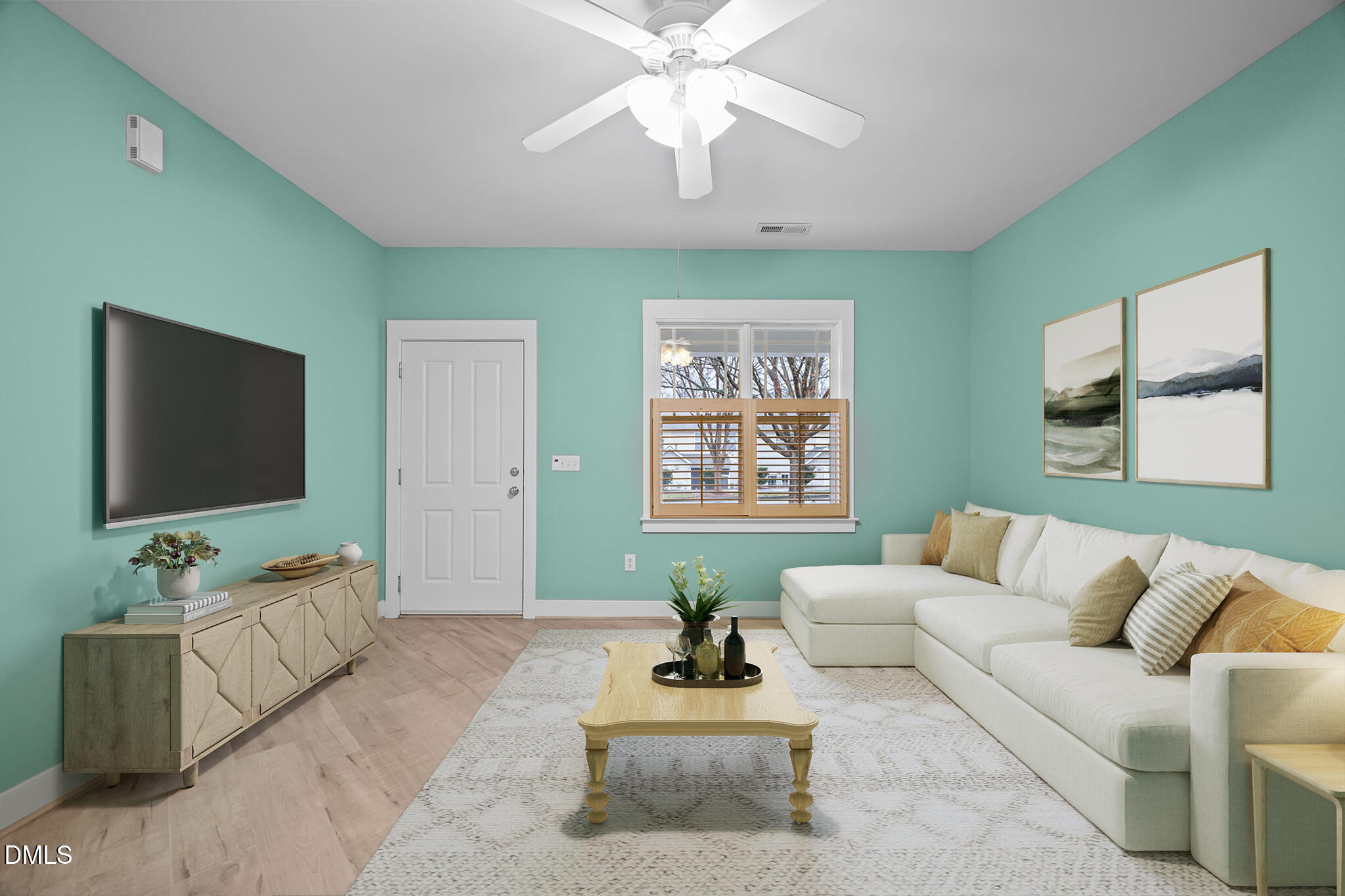 2817 Falls River Avenue Raleigh, NC 27614 - Photo 10 of 60 a living room with furniture and a flat screen tv