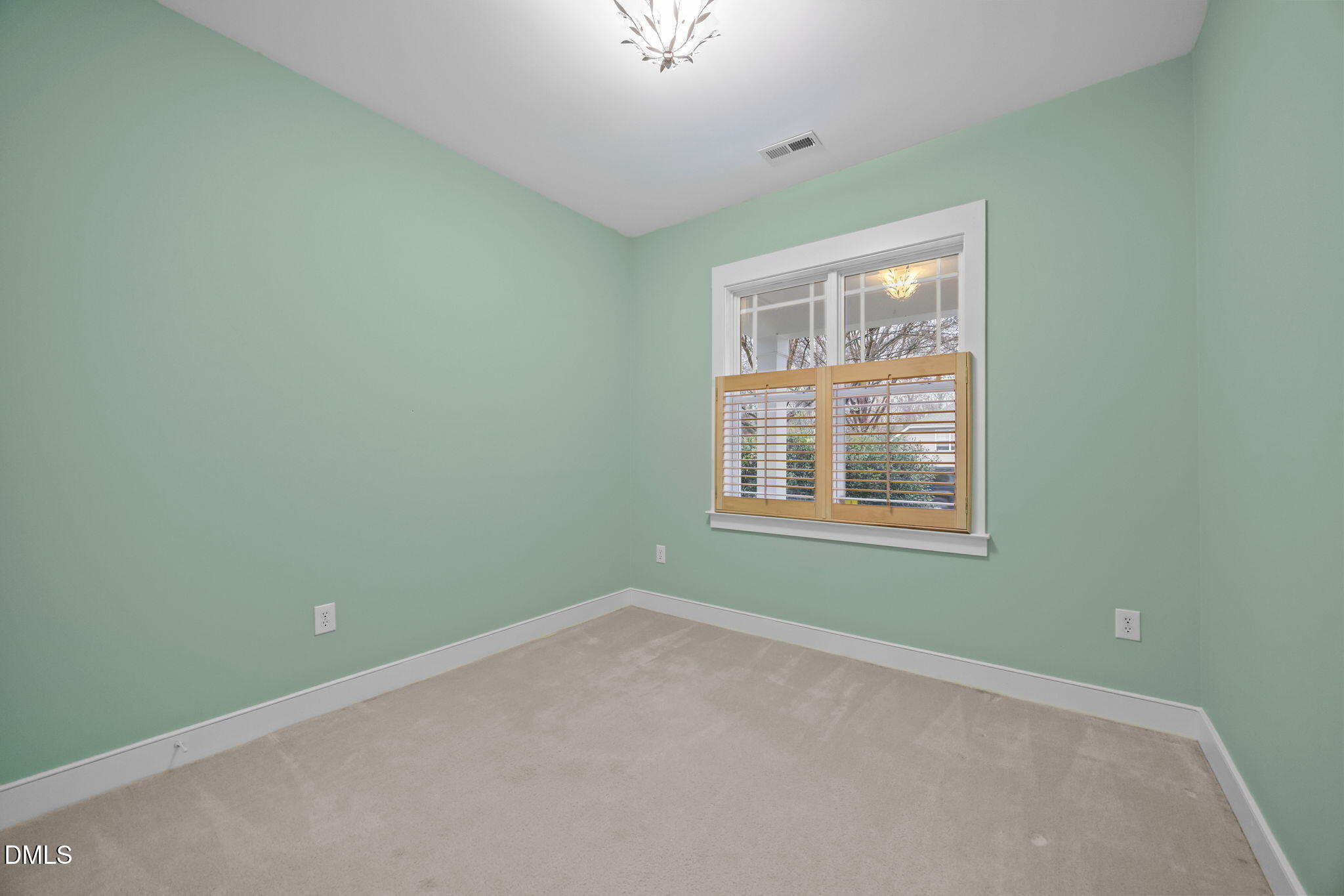 2817 Falls River Avenue Raleigh, NC 27614 - Photo 15 of 60 an empty room with a window