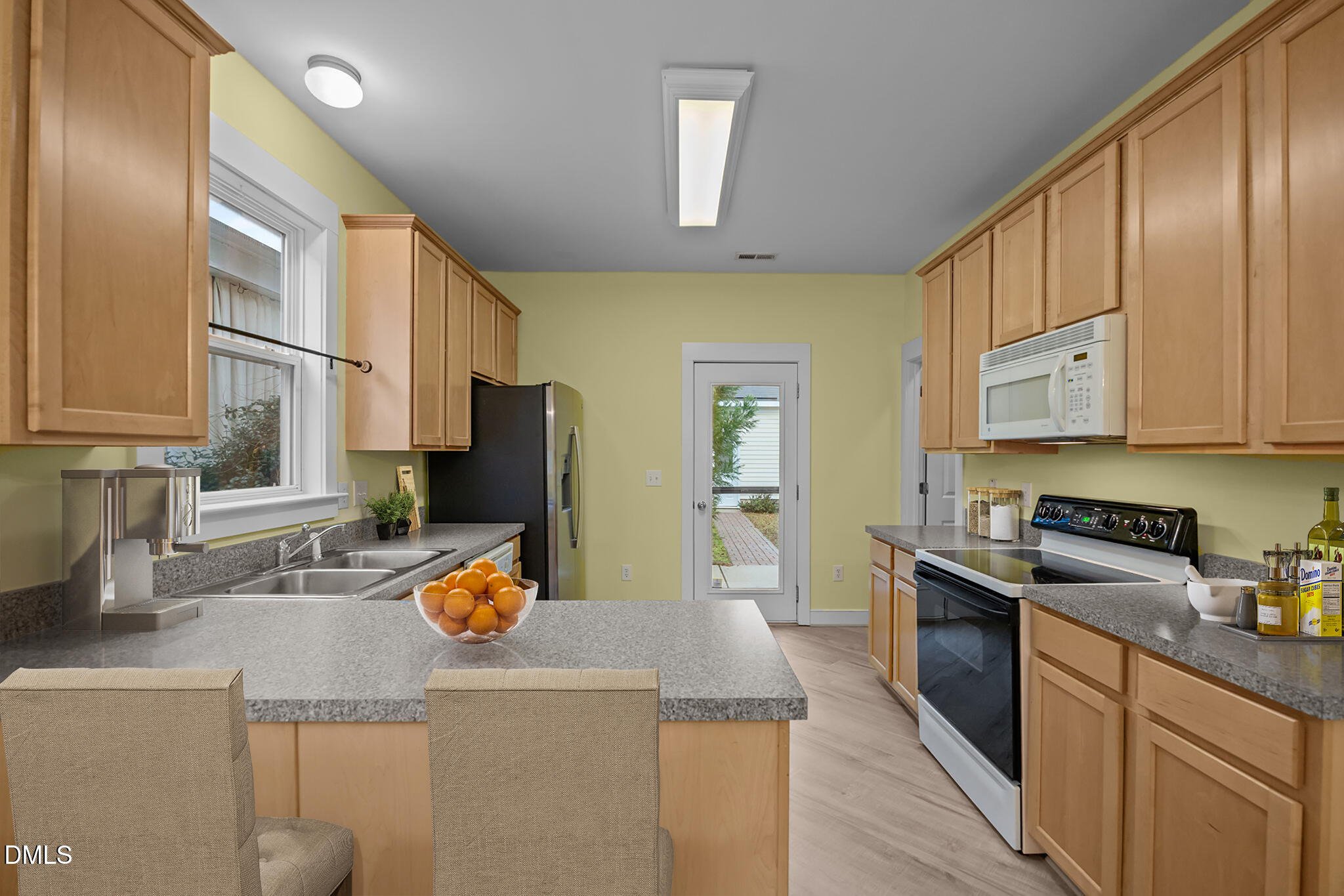 2817 Falls River Avenue Raleigh, NC 27614 - Photo 24 of 60 a kitchen with stainless steel appliances granite countertop a sink stove and refrigerator