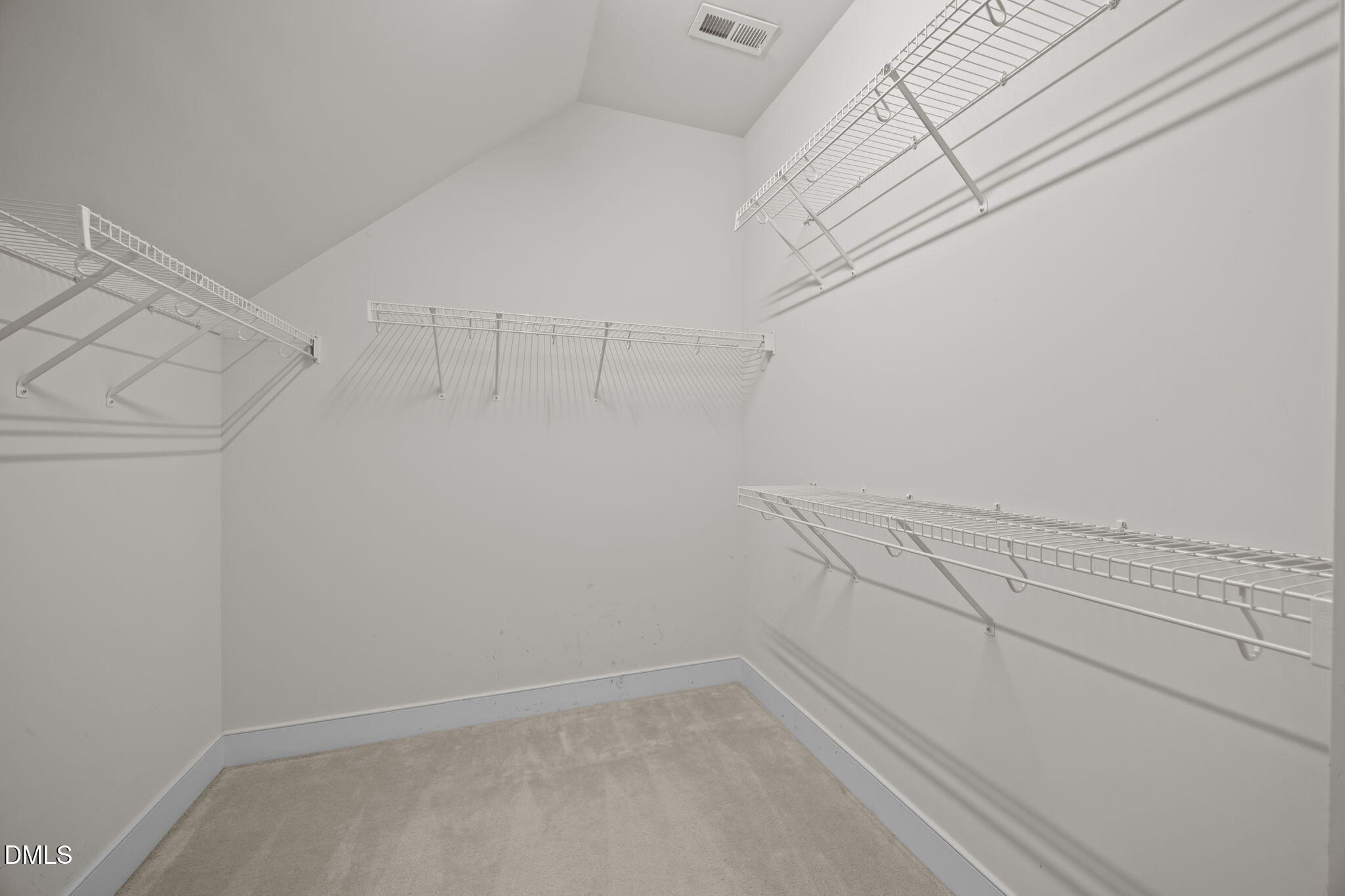 2817 Falls River Avenue Raleigh, NC 27614 - Photo 34 of 60 a view of a room with racks on the wall