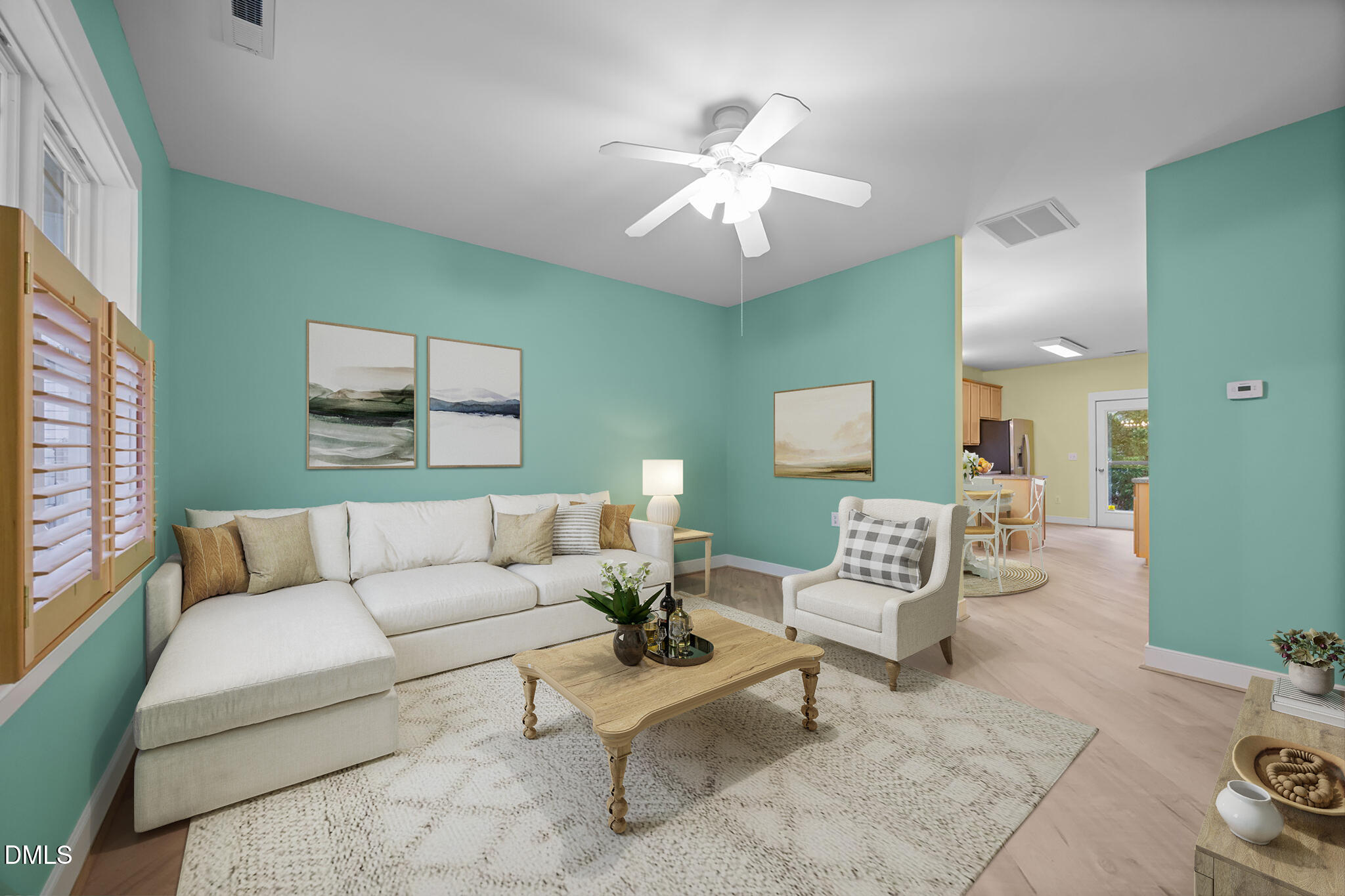 2817 Falls River Avenue Raleigh, NC 27614 - Photo 4 of 60 a living room with furniture and a chandelier