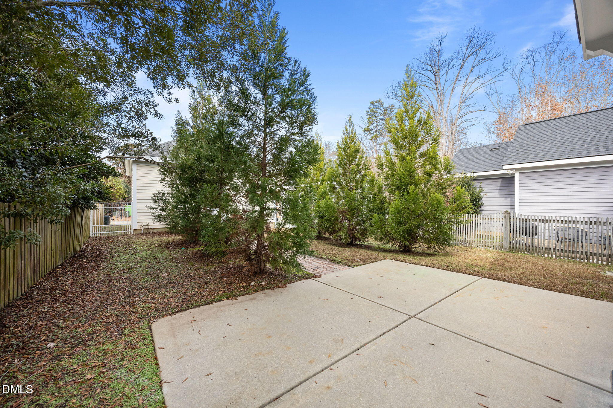 2817 Falls River Avenue Raleigh, NC 27614 - Photo 52 of 60 a view of a yard with plants and trees
