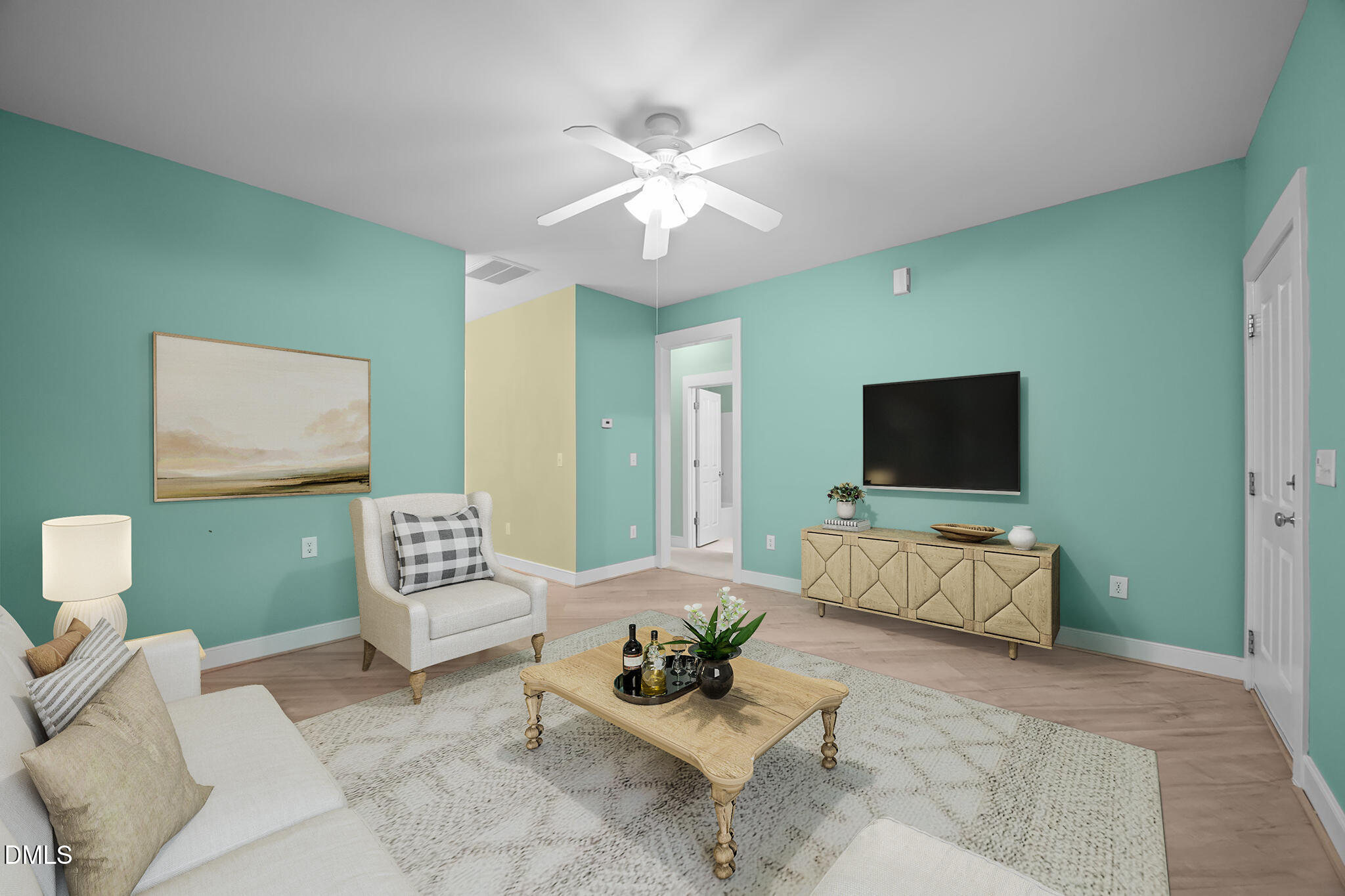 2817 Falls River Avenue Raleigh, NC 27614 - Photo 6 of 60 a living room with furniture and a flat screen tv