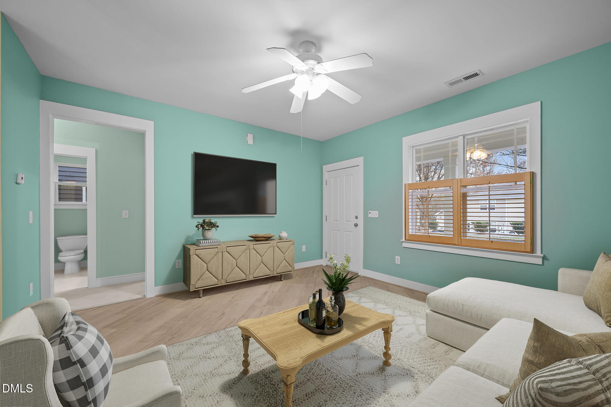 2817 Falls River Avenue Raleigh, NC 27614 - Photo 8 of 60 a living room with furniture and a flat screen tv