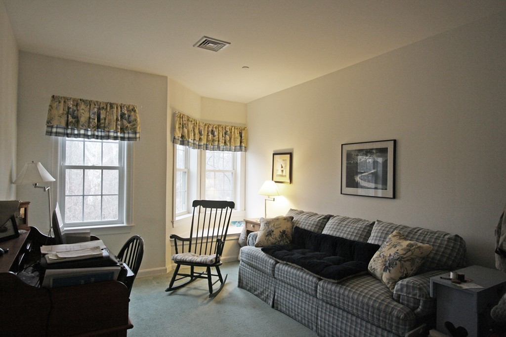 190 Chickering, Unit 210D North Andover, MA 01845 - Photo 10 of 16 a living room with furniture and a window