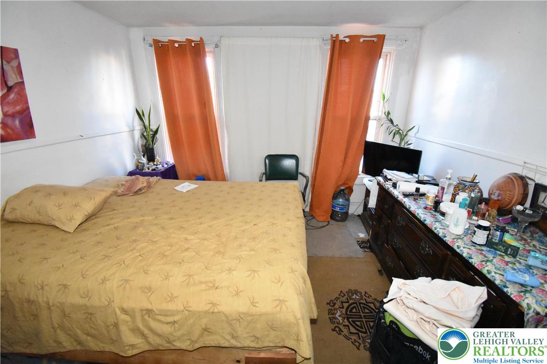 22 South Raspberry Street Easton, PA 18042 - Photo 11 of 16 a bedroom with a bed and a window