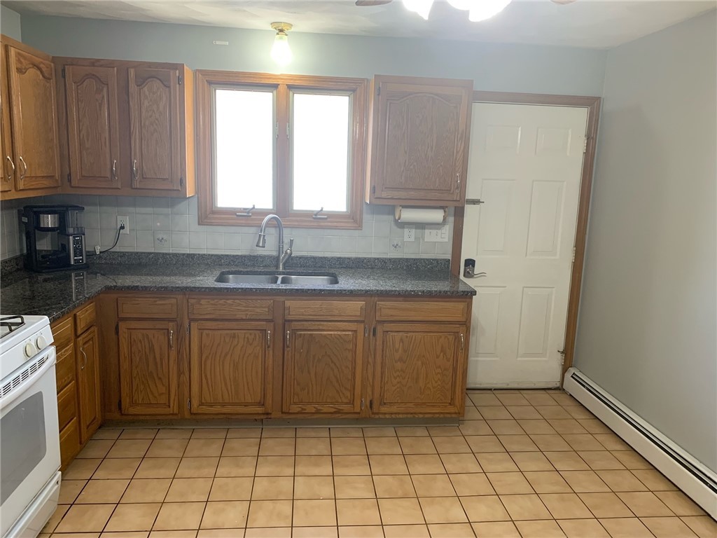 14 Curran Road Cumberland, RI 02864 - Photo 6 of 19 additional view of kitchen looking toward back of home.
